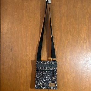Dakine crossbody purse.Zipper pockets on front and 1 in bag.Strap is adjustable.